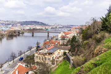Fototapeta na wymiar Bridges on the Vltava River. View from Vyshegrad rock in the early spring on a sunny day. Area of the old town in Prague, Czech Republic.