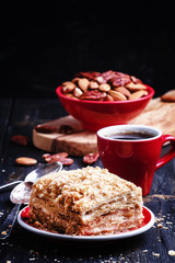 Traditional Russian layer cake and coffee, selective focus