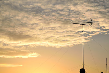 The&nbsp;sunset&nbsp;sky&nbsp;and antenna.
