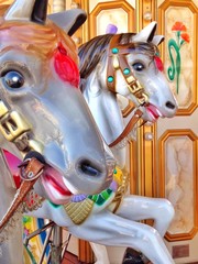 Fototapeta na wymiar Carousel horse ride at amusement park