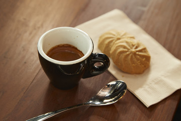 Black coffee is eaten with cookie