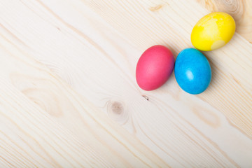 Easter composition on light wooden background