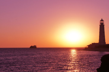Fototapeta na wymiar Lighthouse on the black sea. Crimea. Sunset