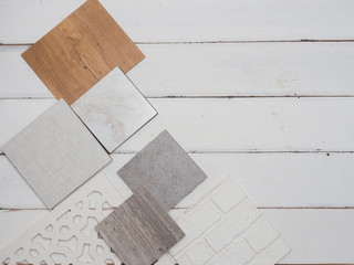 samples of material, wood , color, on wooden table.Interior design select material for idea.