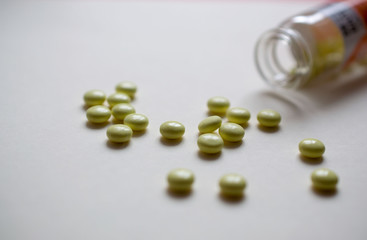 Glass tube with yellow tablets

