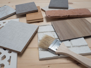 samples of material, wood , color, on wooden table.Interior design select material for idea.
