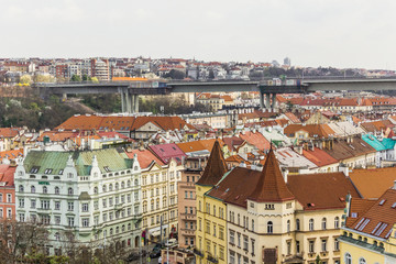 Obraz premium The view from Vyshegrad rock to city of Prague in the early spring on a sunny day. Area of the old town in Prague, Czech Republic.