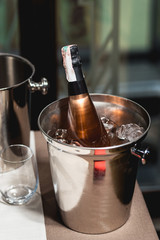Bottle of champagne in bucket in a restaurant