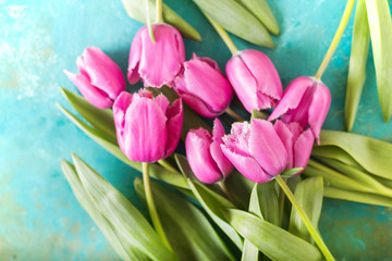 Obraz na płótnie Canvas Pink tulip on turquoise abstract background. Pink tulip. Tulips. Flowers. Flower background. Flowers photo concept. Holidays photo concept. Copyspace