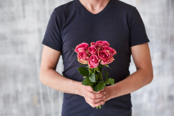 a man with roses in his hands