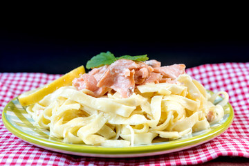 tasty pasta with salmon on a the table