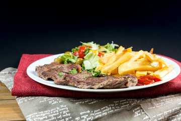 juicy steak beef meat with tomato and french fries