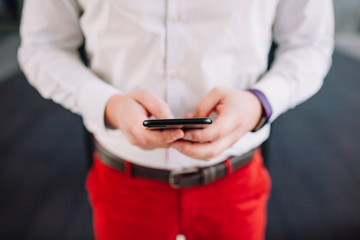 Man using a smartphone. Modern digital concept. Close-up corporate smartphone approach.