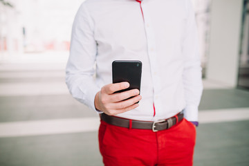Man using a smartphone. Modern digital concept. Close-up corporate smartphone approach.