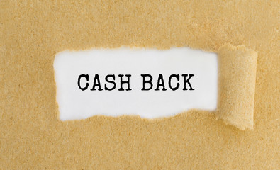 Text Cash Back appearing behind ripped brown paper.