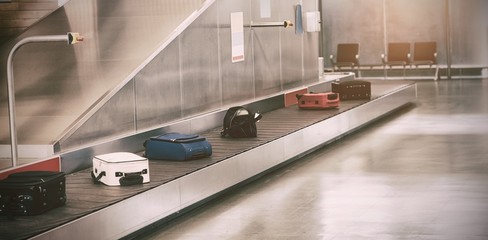 Luggage passing through baggage claim
