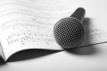 microphone lies on the music book