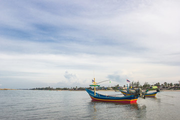Naklejka na ściany i meble Thai fishing boats with blue sky
