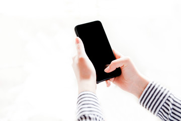 Woman using mobile smartphone. Modern or business concept. Close-up corporate smartphone approach.