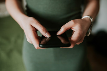 Woman using mobile smartphone. Modern or artistic concept. Close-up vintage smartphone approach.
