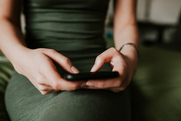 Woman using mobile smartphone. Modern or artistic concept. Close-up vintage smartphone approach.