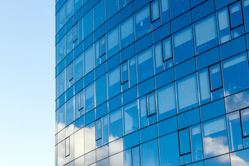 Fototapeta na wymiar Modern office building, with a clean view of the sky. Economic and financial concept. Facade glass building background and sky view.