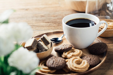 black coffee in white cup with cookie and dessert - Powered by Adobe