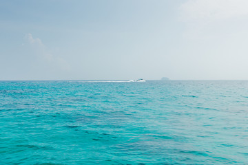Fototapeta na wymiar Phuket thailand andaman sea surface summer wave background. Maiton island