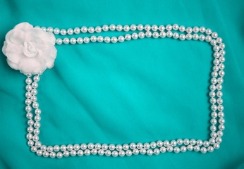 Textile rose and beads frame cyan blue wedding glamour photo background