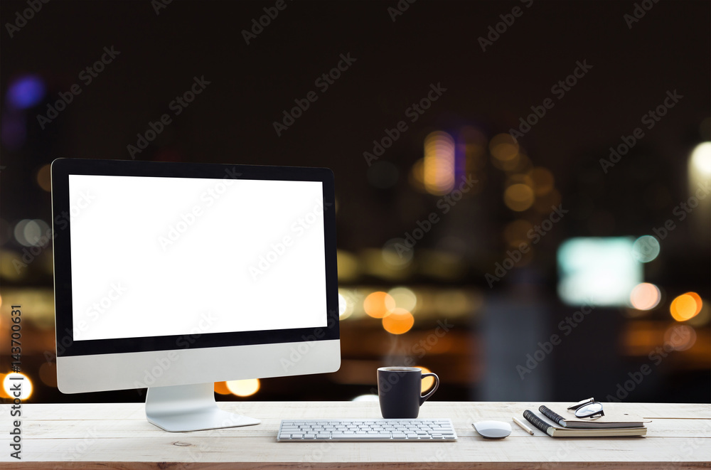Poster desktop computer on work table and city night background