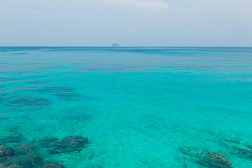 Fototapeta na wymiar Phuket thailand andaman sea surface summer wave background. Maiton island