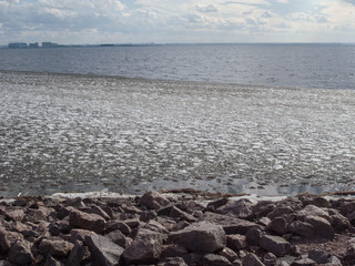Spring, shore of the bay. Early spring on the shore of the Gulf of Finland.