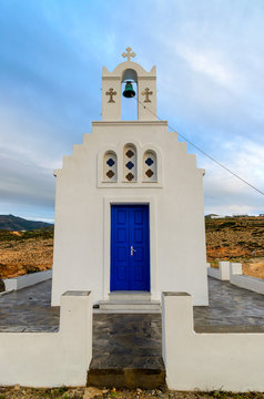 Traditional greek white church on rocky coast on the Paros Island, Cyclades. Greece.