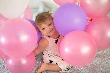 Crazy Toddler  with balloons, children's holiday