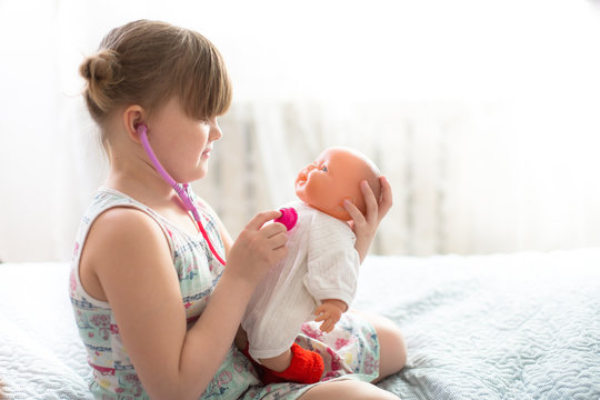 Kid Girl Playing With Doll, Playing Doctor