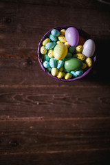 Easter eggs on wooden background. Can be personalized with your message for a festive Easter card.