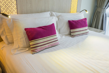 Comfortable pillows and bed .