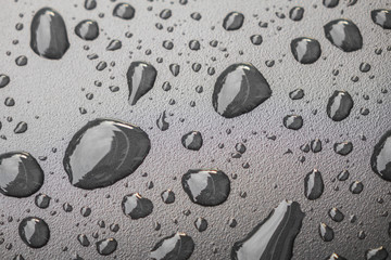 Water drops on black blackground .
