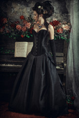 Fototapeta na wymiar Woman with piano