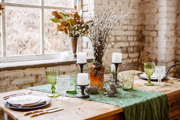 Loft interior with brick wall, table and chairs