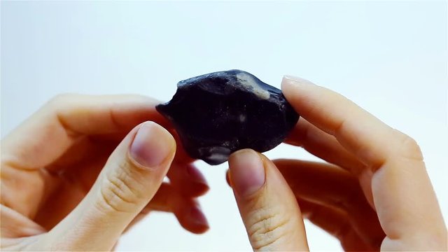 Flint &ndash; a variety of chert. Jeweler holding Flint mineral