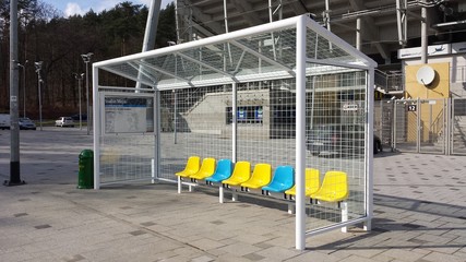 Gdynia, Poland - April 08, 2017: Bus stop in the shape of a football goal. Yellow blue chair.
