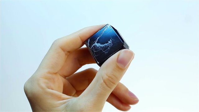 Hematite (haematite) is the black mineral form of iron. Jeweler holding Hematite