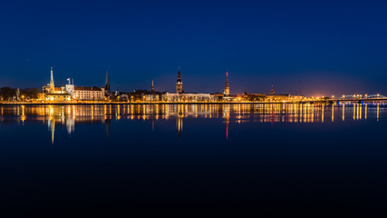 summer night city light reflections over water
