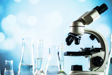 Science laboratory research and development concept. microscope with test tubes