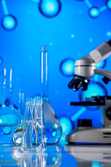 Science laboratory research and development concept. microscope with test tubes