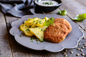 Vegetarian lentil burgers with potato and dip