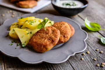 Vegetarian lentil burgers with potato and dip