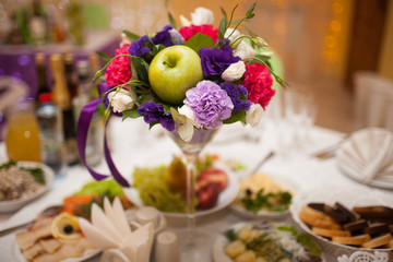 Table set for wedding dinner decorated with flowers