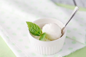 Two scoops of white ice cream - lemon, vanilla or coconut flavor